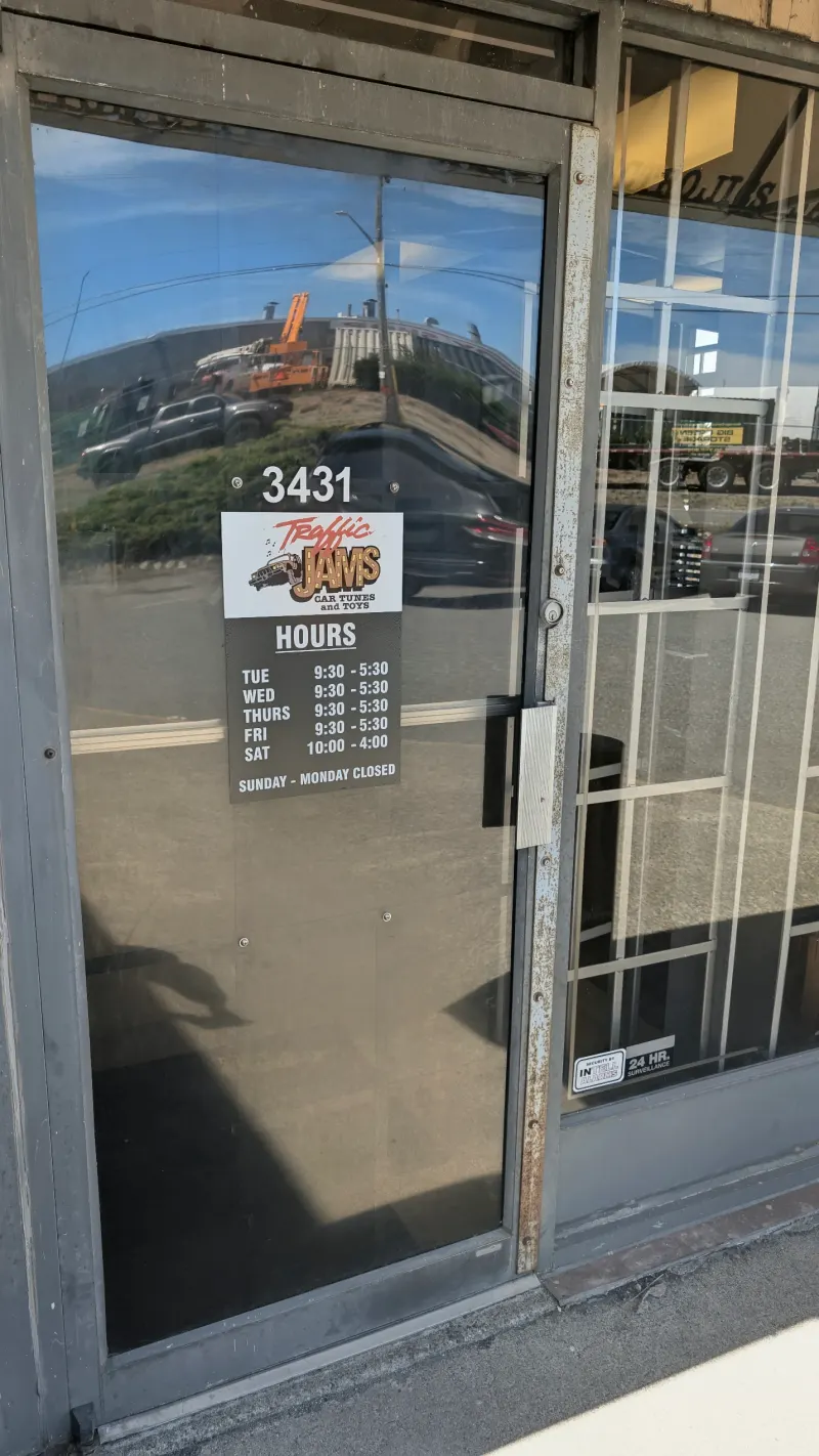 Traffic Jams Car Tunes & Toys shop entrance and posted hours